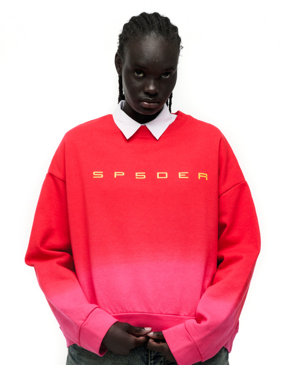 Red to pink gradient crewneck with yellow "SP5DER" text on chest.