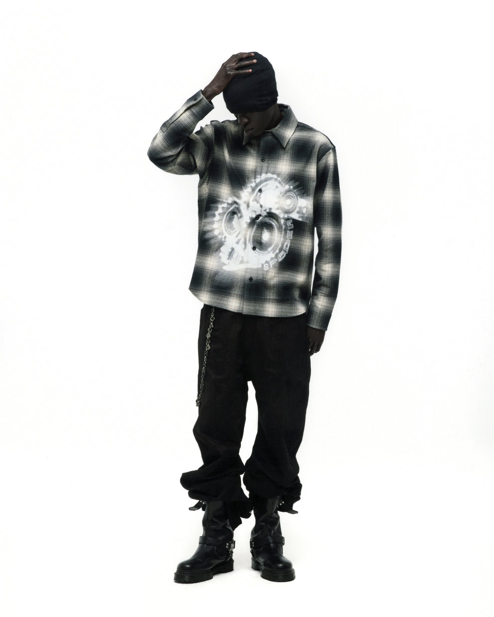 Burnout Flannel: Black and white plaid cotton shirt with faded graphic print, worn by a model.