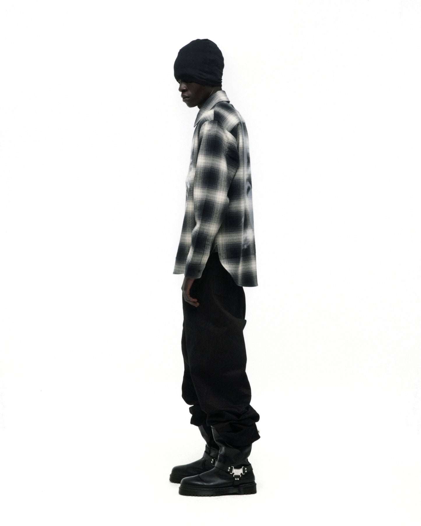 Burnout Flannel: Black and white faded plaid cotton flannel shirt with spread collar, button closure, and shirttail hem.