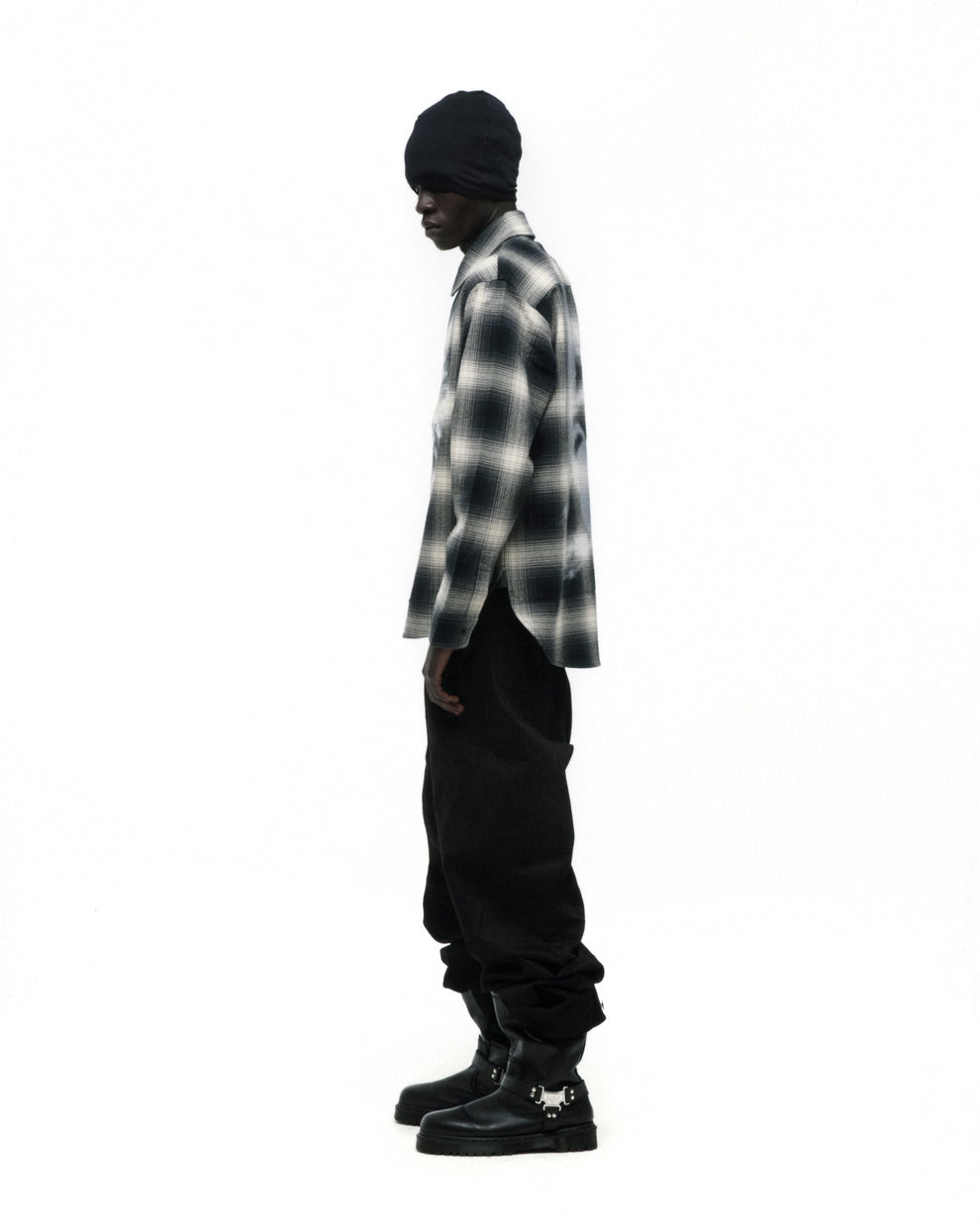 Burnout Flannel: Black and white faded plaid cotton flannel shirt with spread collar, button closure, and shirttail hem.