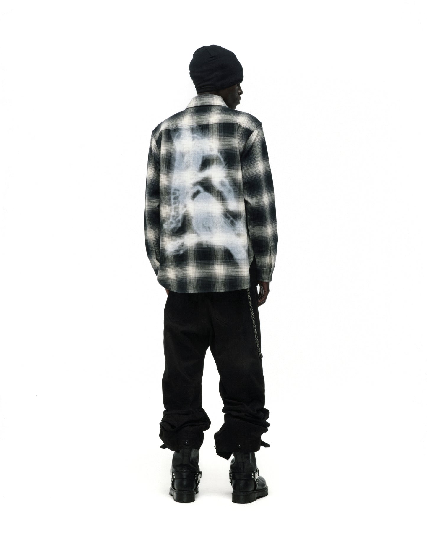 Burnout Flannel: Black and white plaid cotton shirt with faded graphic print on back.