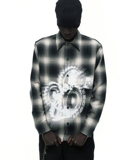 Black and white plaid cotton flannel shirt with faded gear graphic print on front.