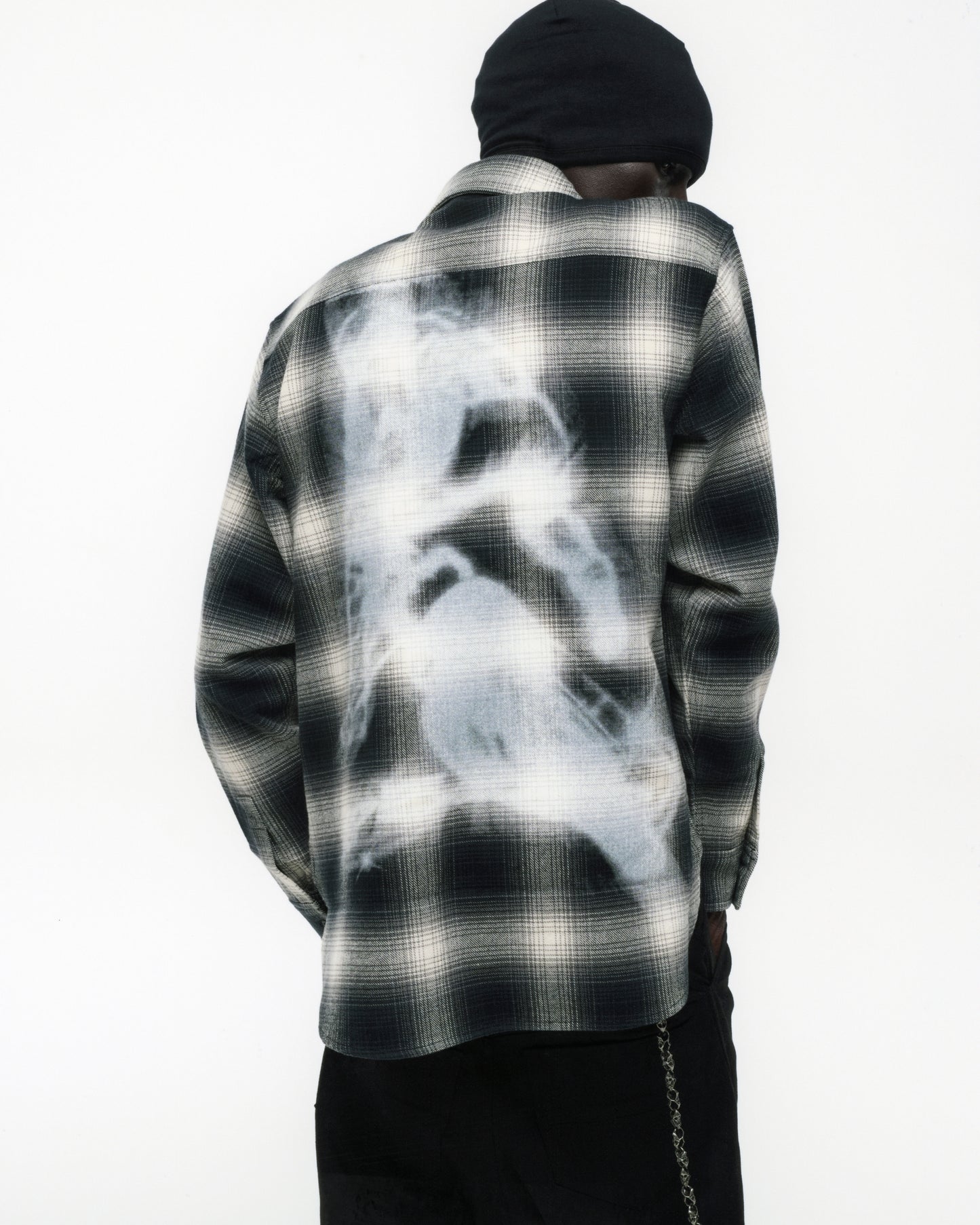 BURNOUT FLANNEL: Cotton flannel shirt with black and white plaid, featuring a faded graphic print on the back.