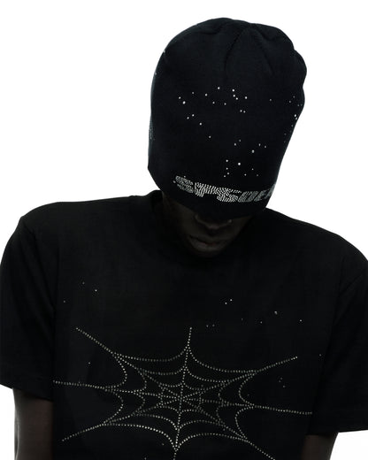 Black acrylic beanie with rhinestone skull design, paired with a black tee featuring a rhinestone spiderweb.