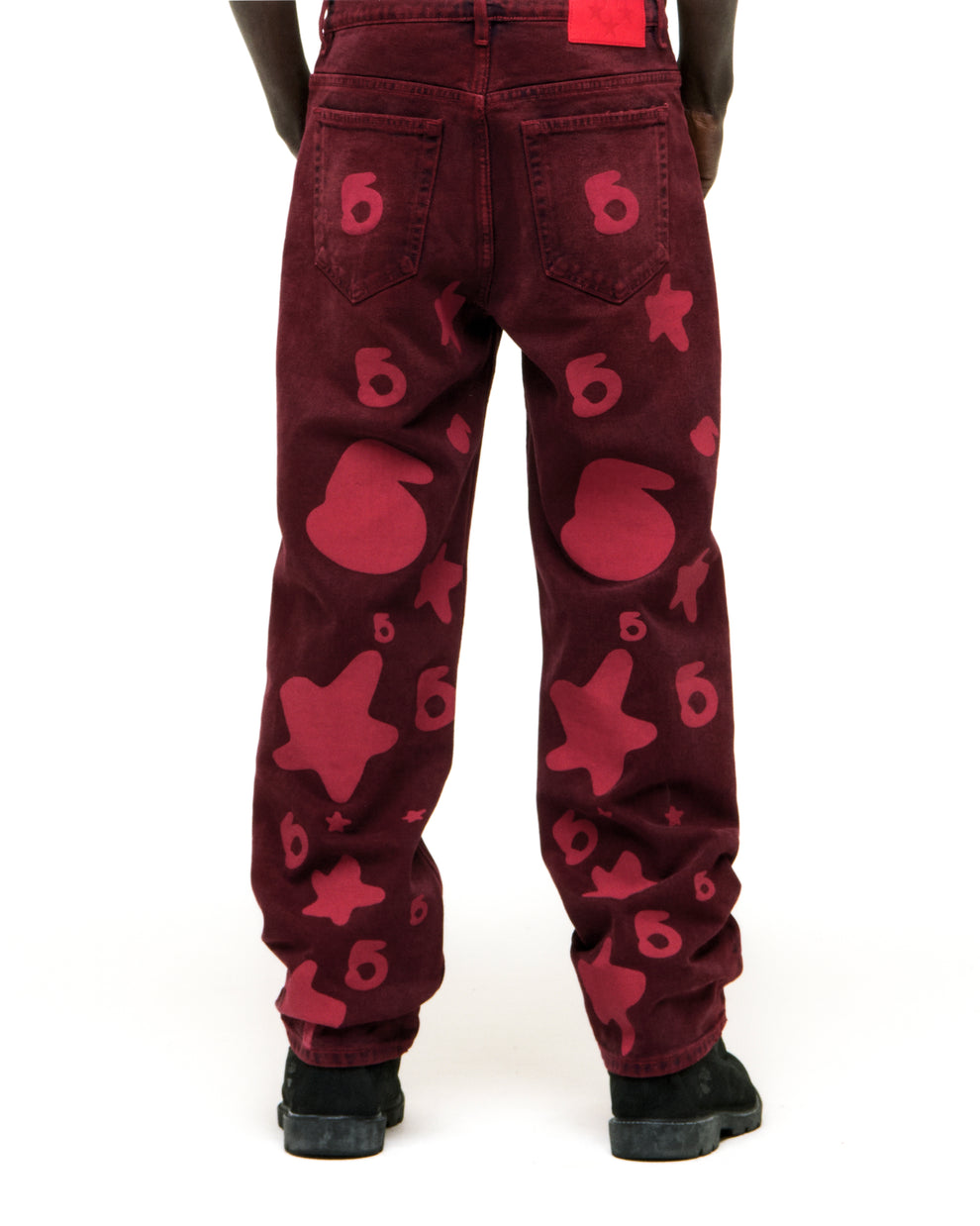 BELUGA DENIM faded wash red jeans with custom "6" and star print, branded back patch, and classic straight leg fit.