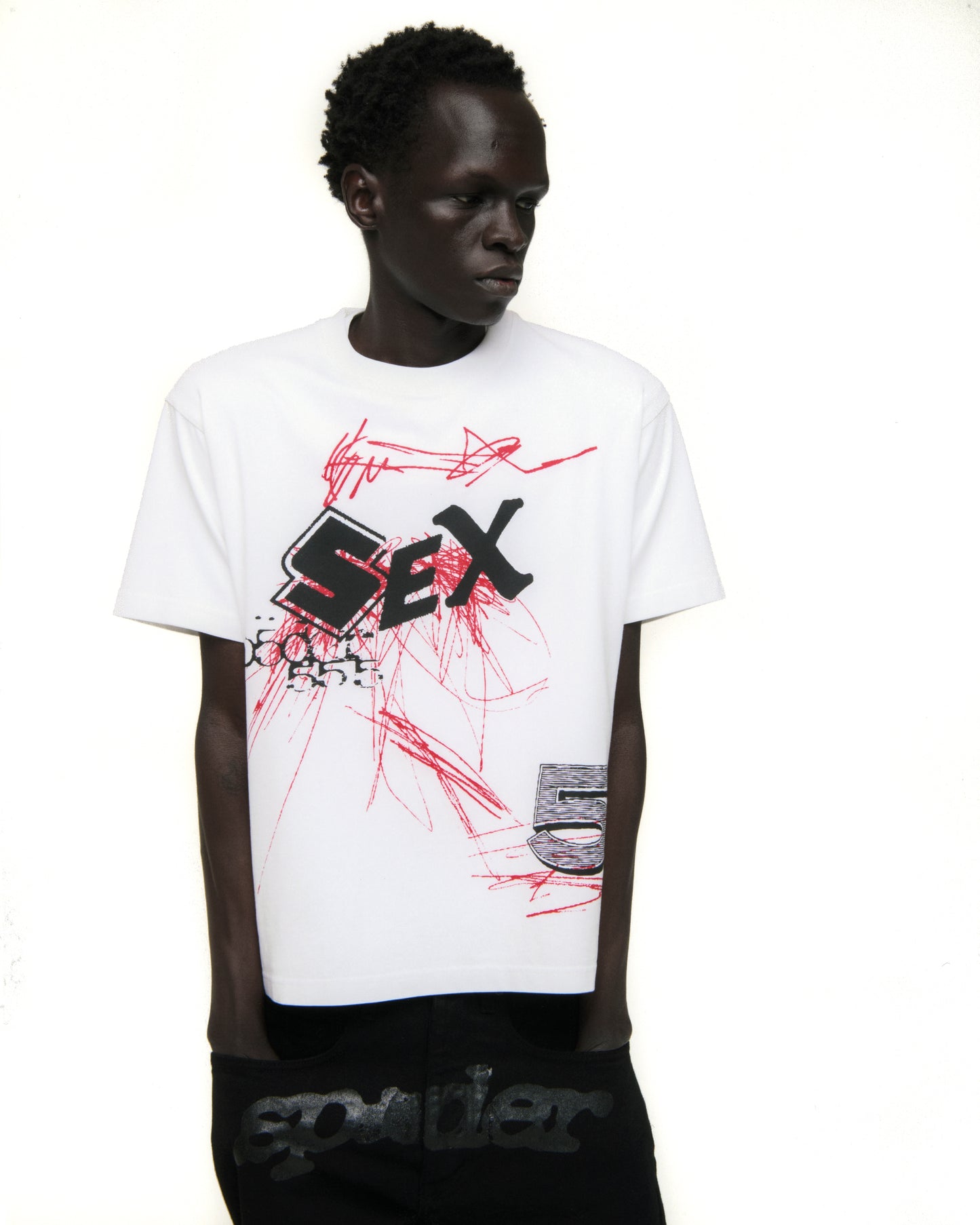 White cotton VIVIENNE TEE with bold black "SEX" graphic and red scribble design.