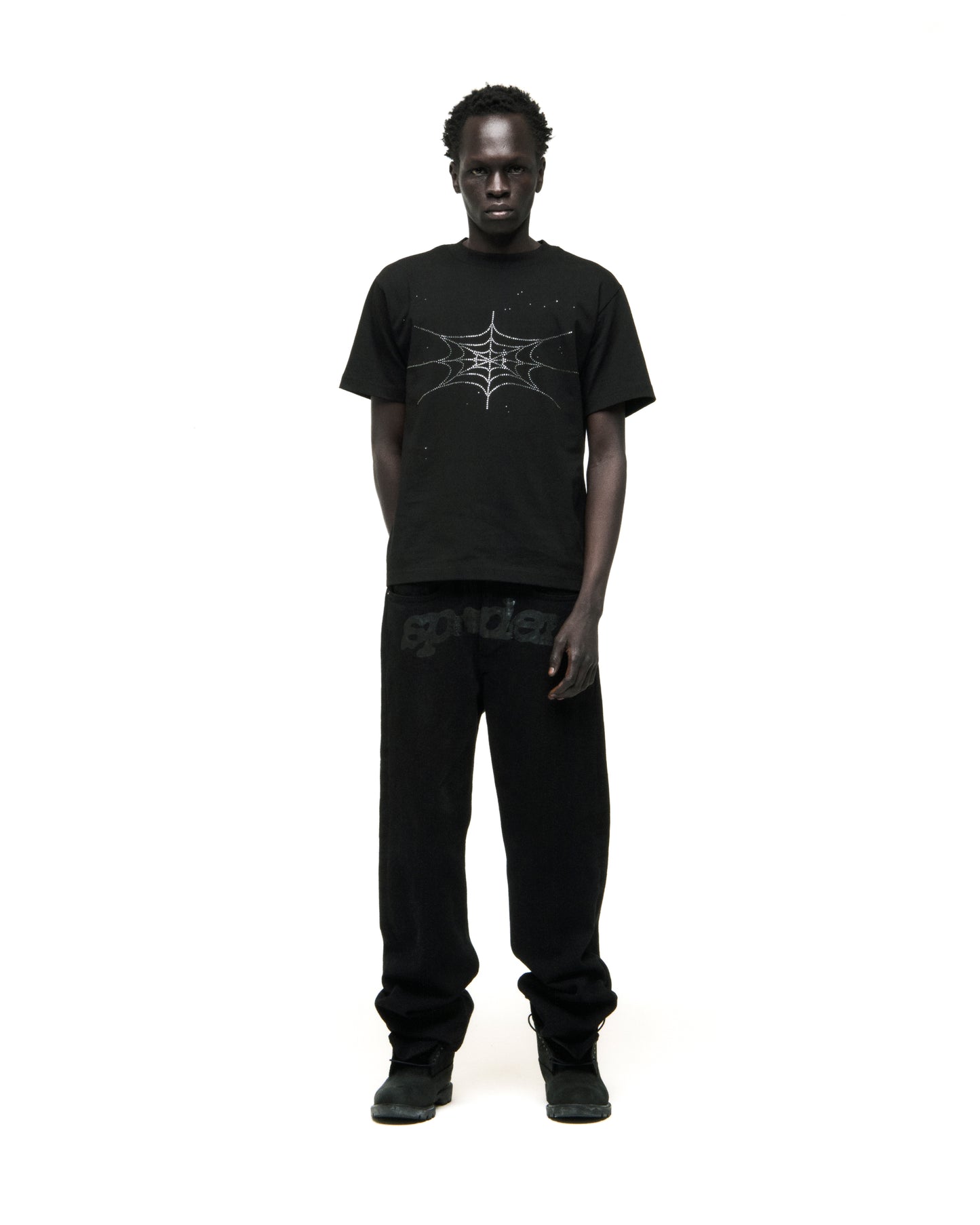 Black cotton tee with rhinestone spiderweb graphic, worn by a man.
