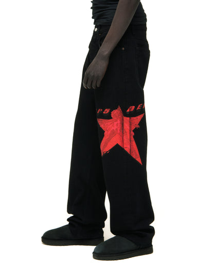 Black denim pants with a large red star graphic on the upper leg.