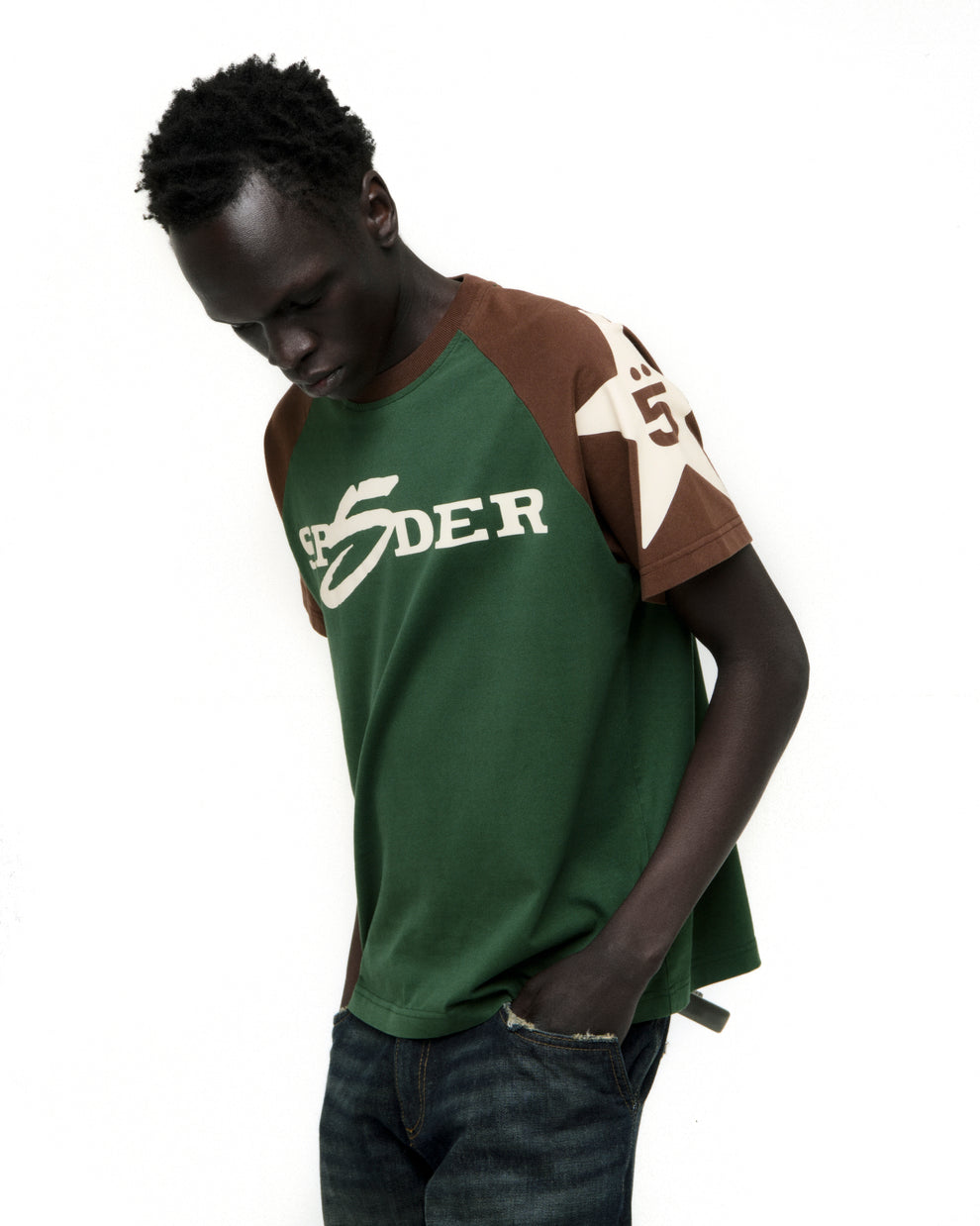 Men's 5UKI TEE: Green and brown color-block cotton tee with "SPIDER" graphic and star on sleeve.