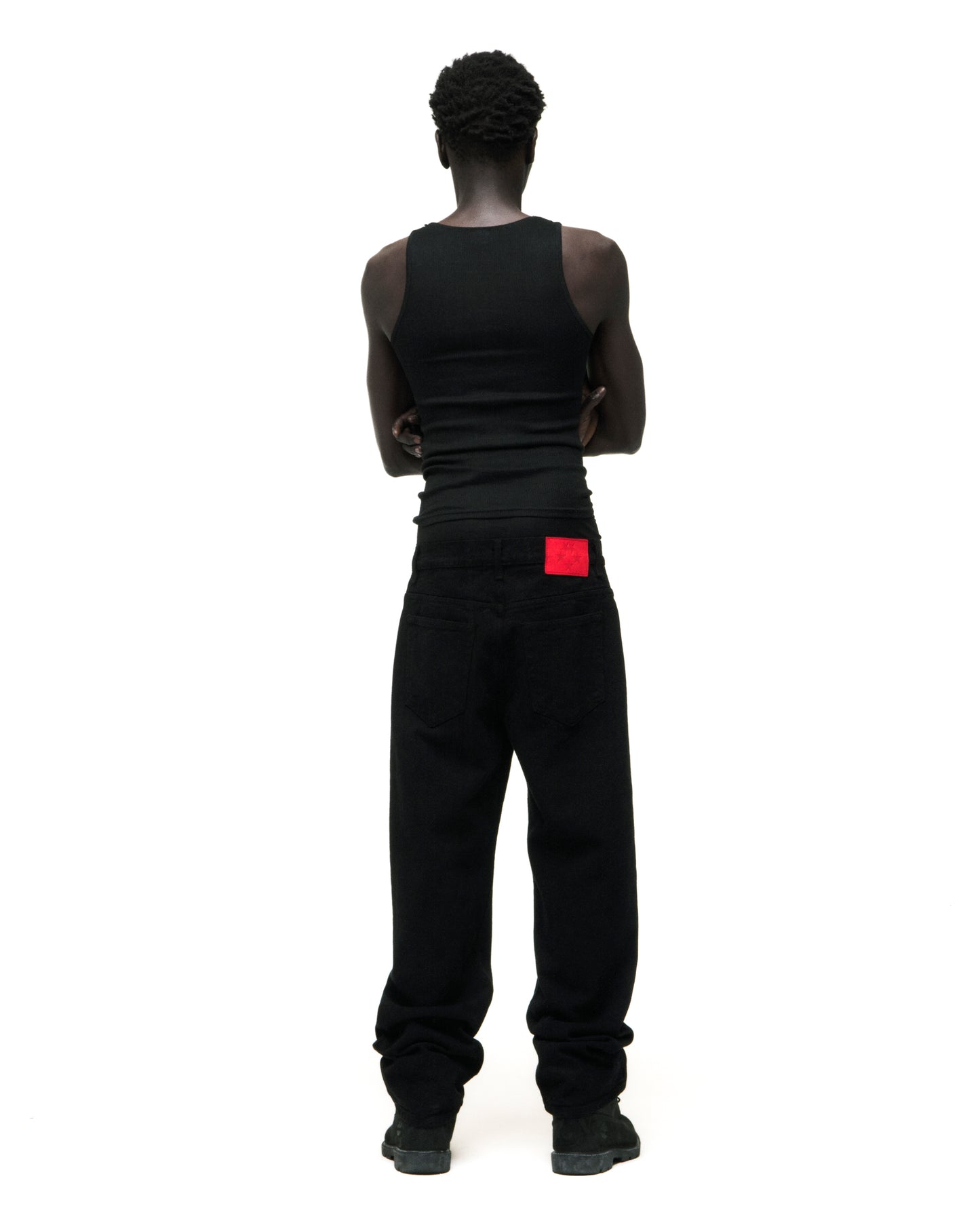 Black V3 DENIM straight leg jeans with a red branded leather back patch.