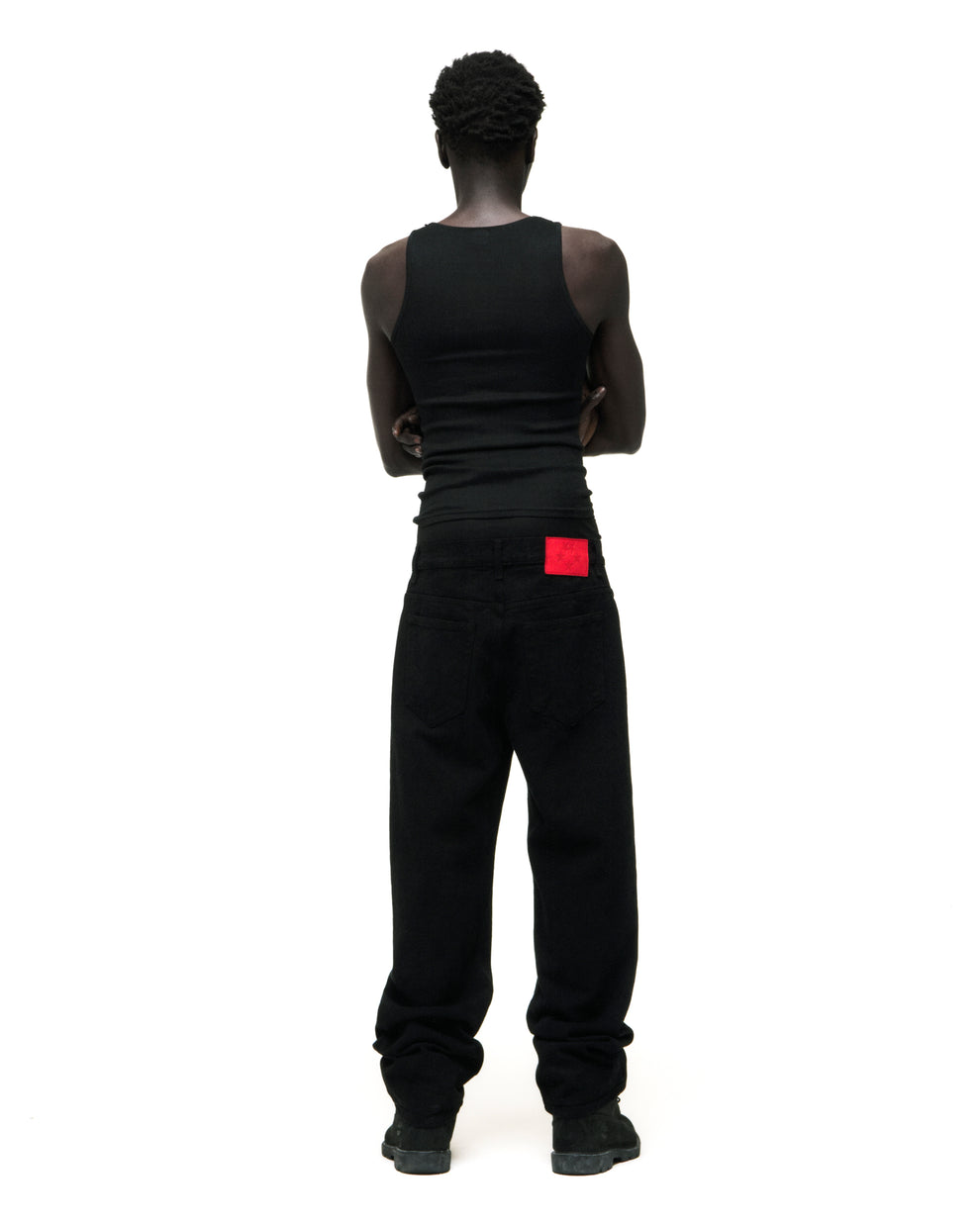 Black V3 DENIM straight leg jeans with a red branded leather back patch.