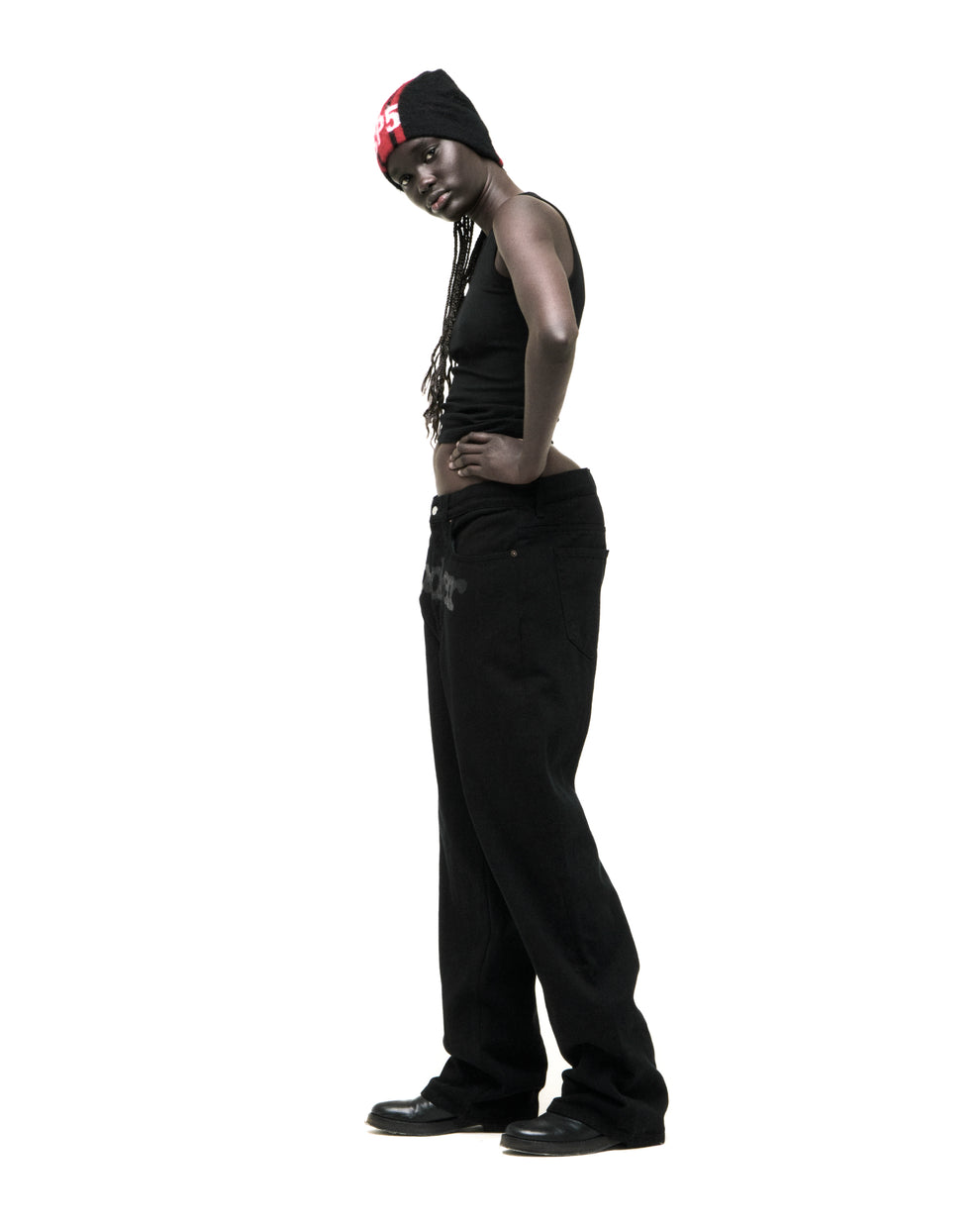 Black V3 DENIM pants with printed logo at crotch, custom hardware, and straight leg fit.