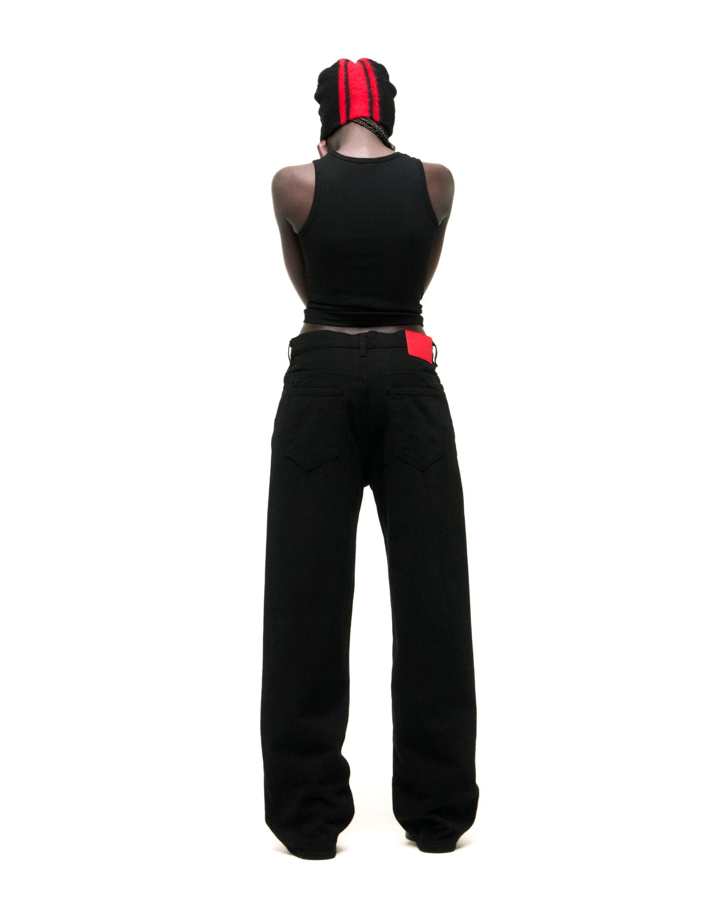 Black V3 DENIM jeans with straight leg fit, five-pocket styling, and red branded back patch.