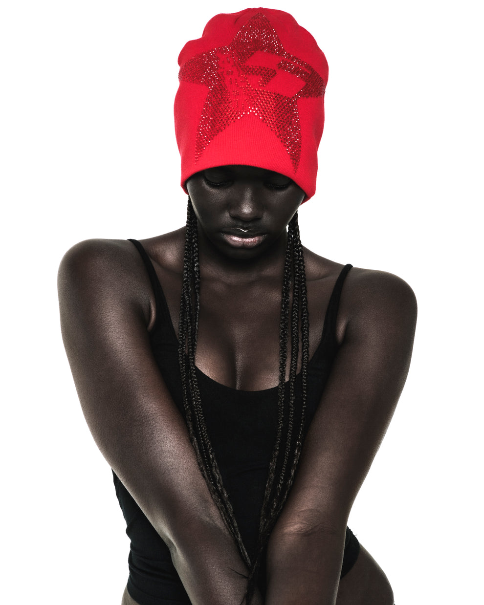 Red acrylic skully with a rhinestone-embellished 5-star design worn by a model.