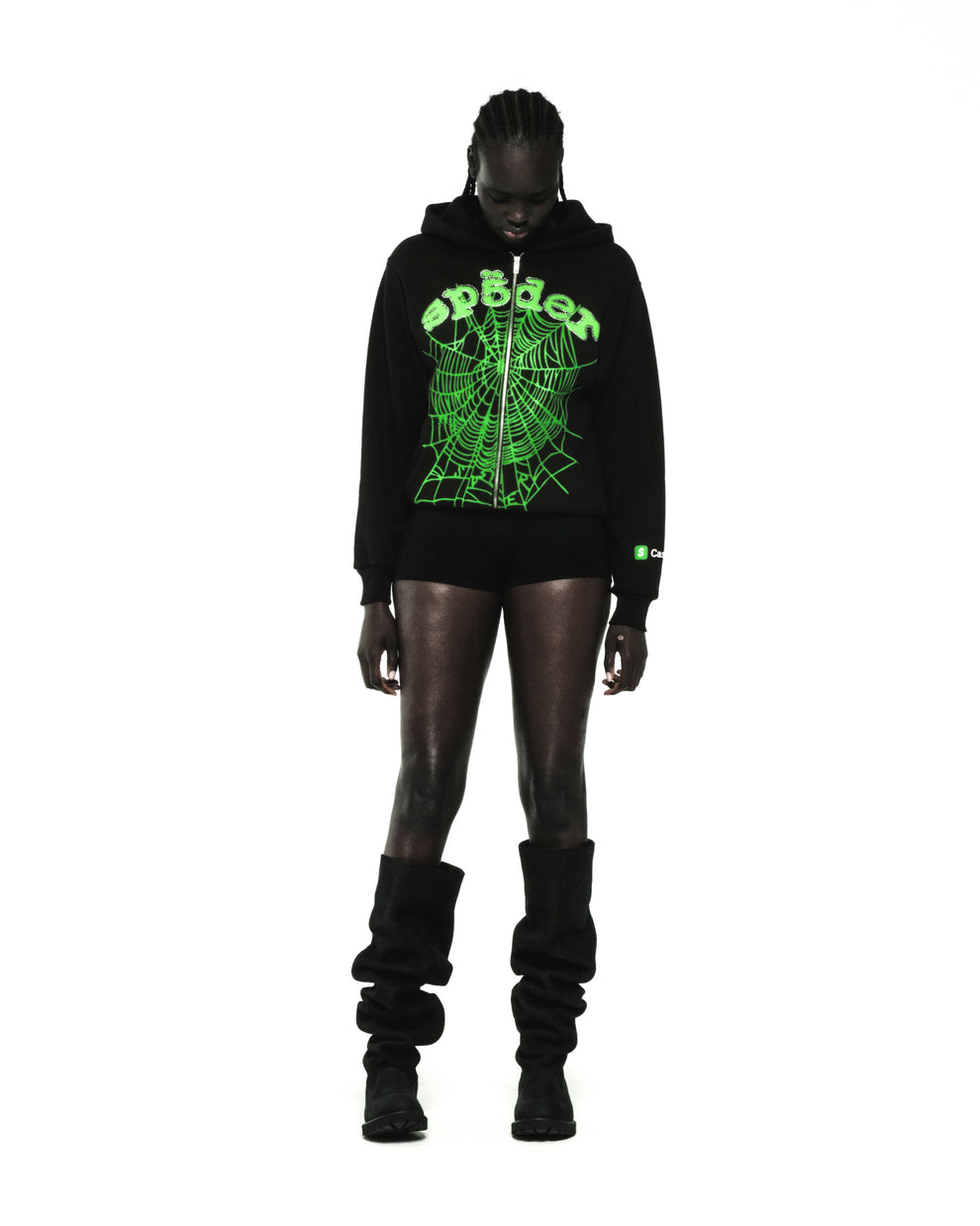 Black cotton fleece zip hoodie with green rhinestone phantom web and "sp5der" graphic.