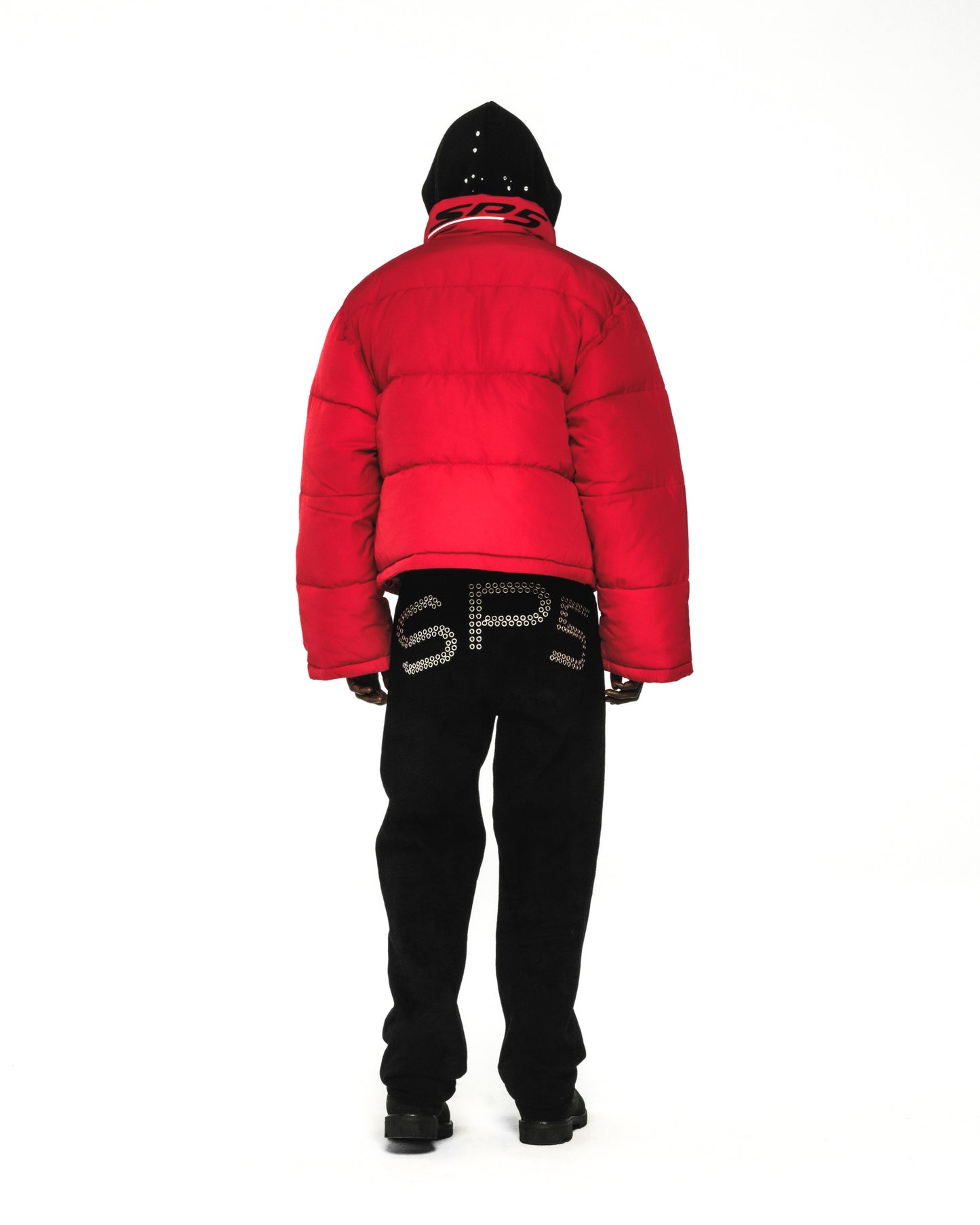 Red poly-fill TRACKHAWK puffer jacket with black hood and pants, viewed from the back.