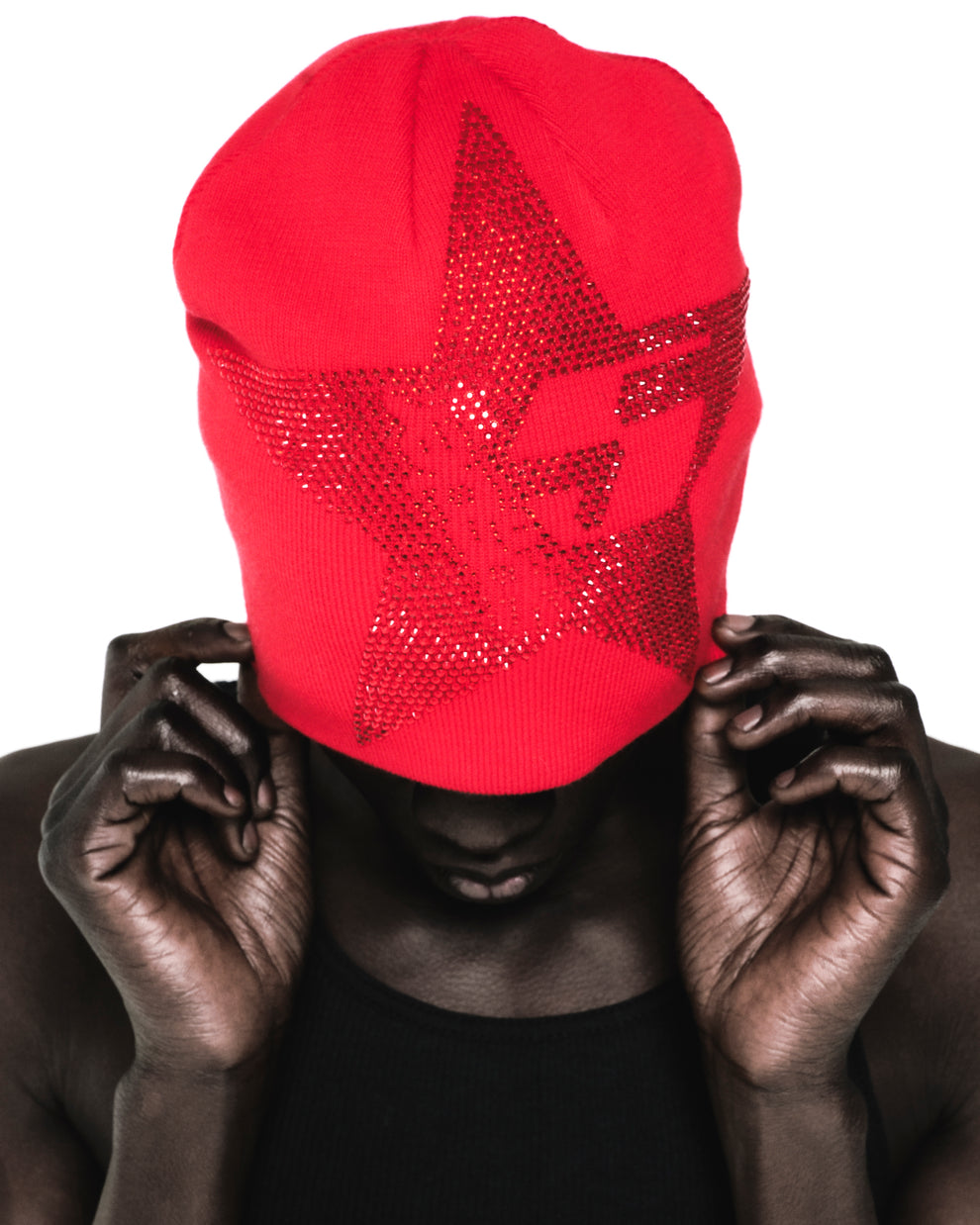 Red acrylic skully with a large, sparkly rhinestone star design covering the face.