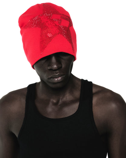 Red acrylic skully with a rhinestone 5-star design, worn by a person in a black tank top.