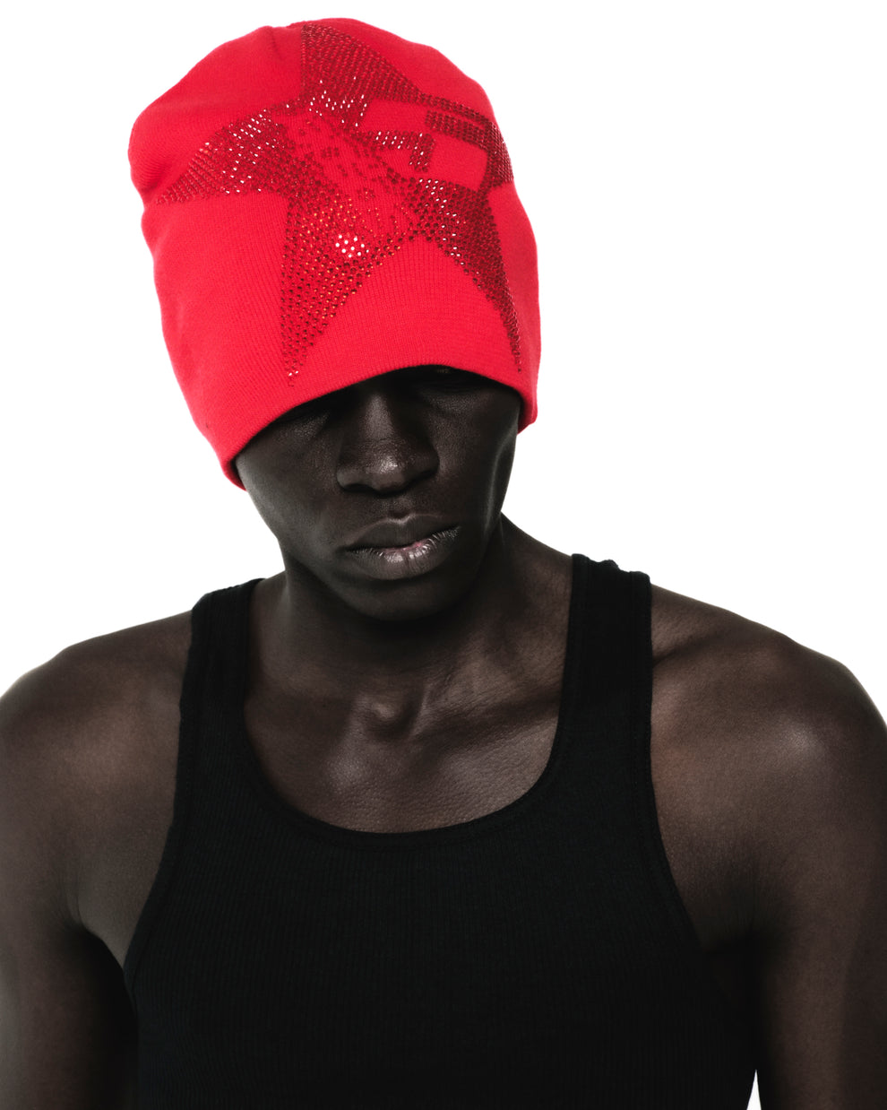 Red acrylic skully with a rhinestone 5-star design, worn by a person in a black tank top.