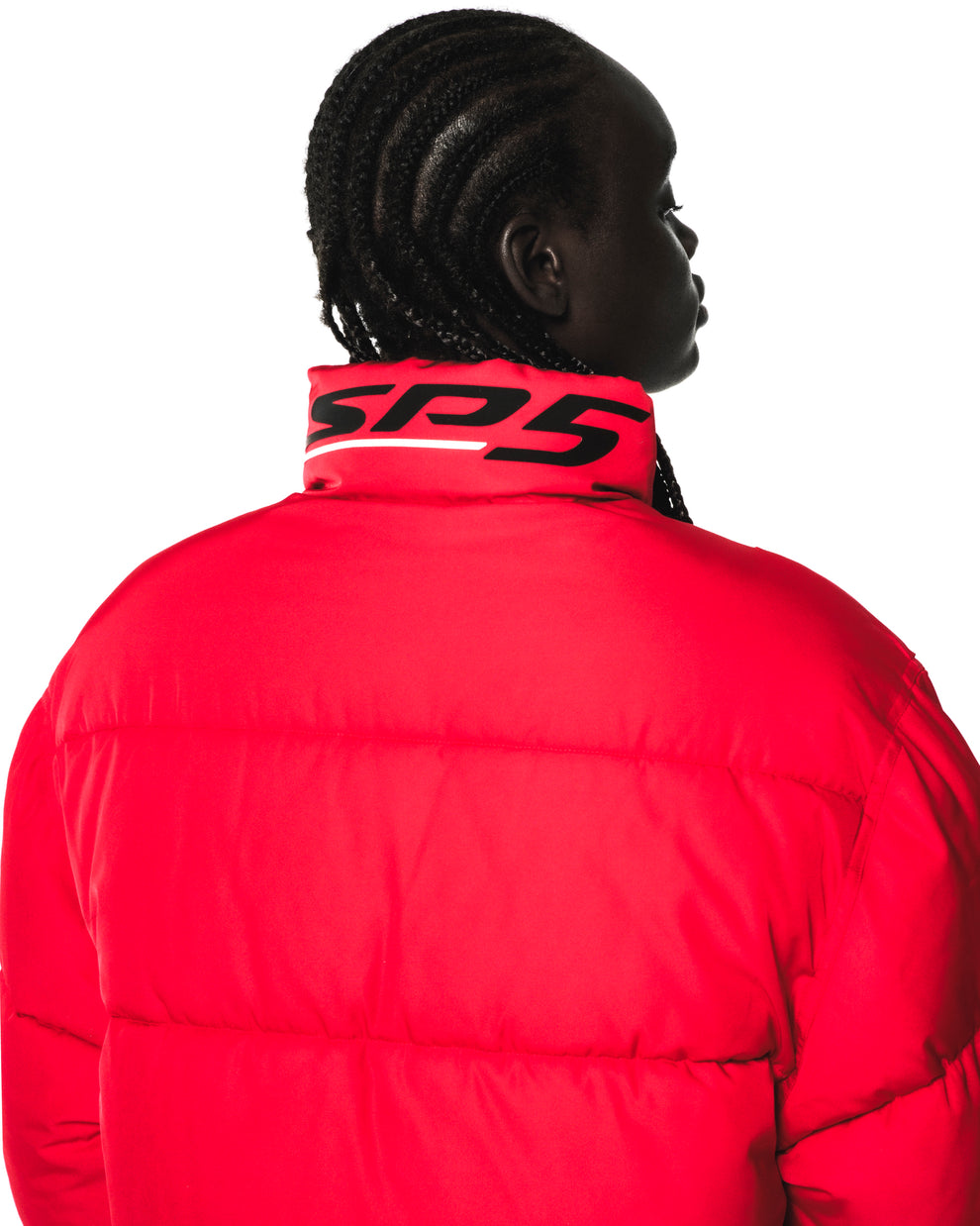 Red TRACKHAWK puffer jacket with "SP5" reflective graphic on the back collar, seen from behind.