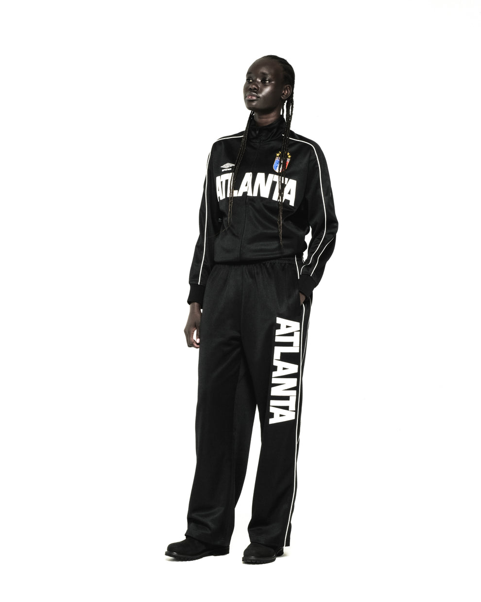 Black polyester ATLANTA TRACK JACKET and matching pants with white lettering, contrasting piping, and SP5DER crest.