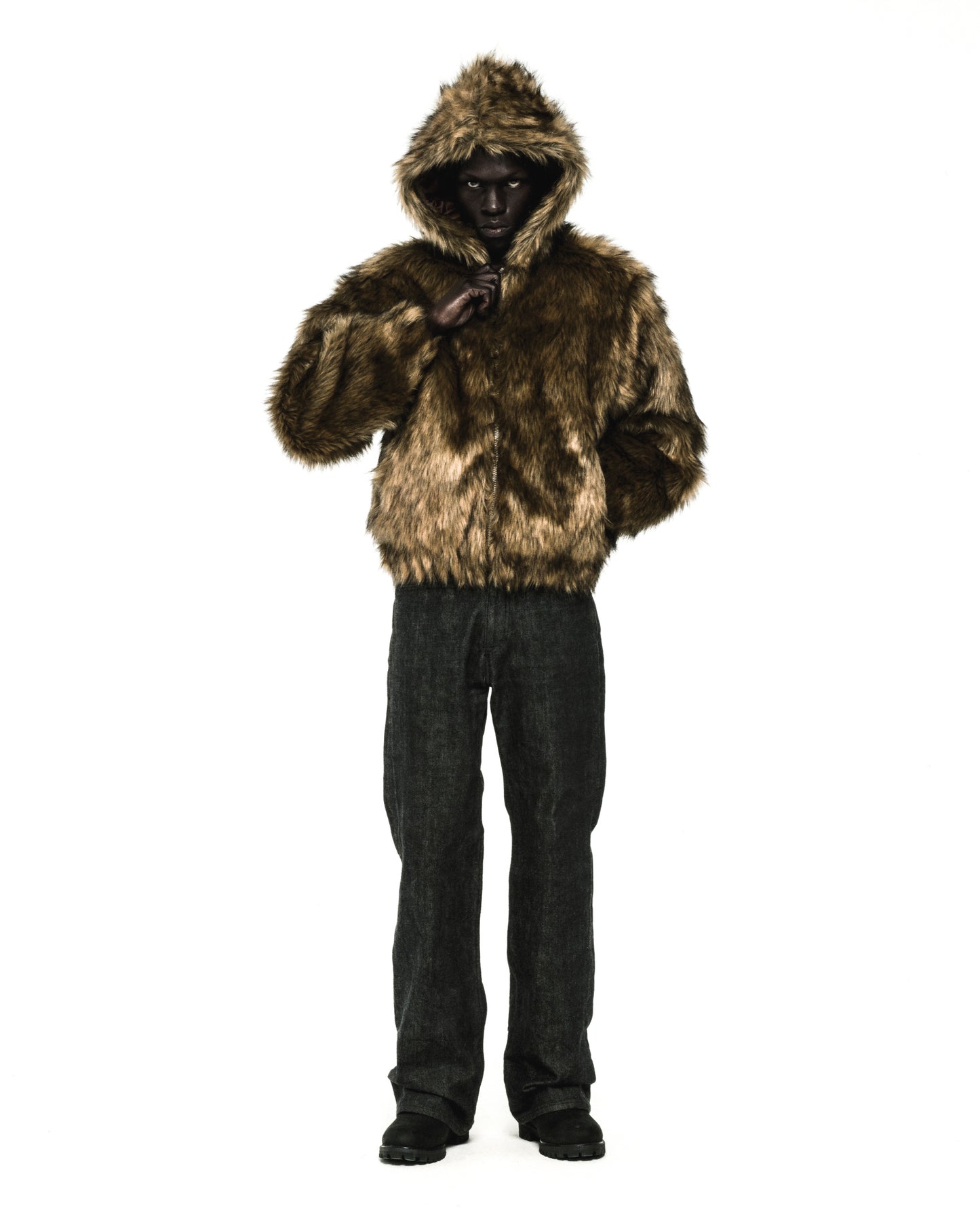 Brown faux fur hooded jacket with zip closure and two pockets, worn by a model.