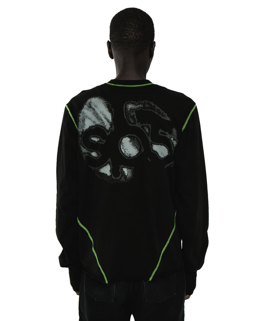 Black cotton long sleeve tee with "SOS" graphic print and neon green contrast stitching.