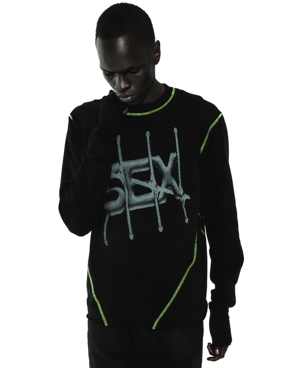 Black cotton SHADOWBANNED LONGSLEEVE with "SEX" graphic, bright green contrast stitching, ribbed collar/cuffs.