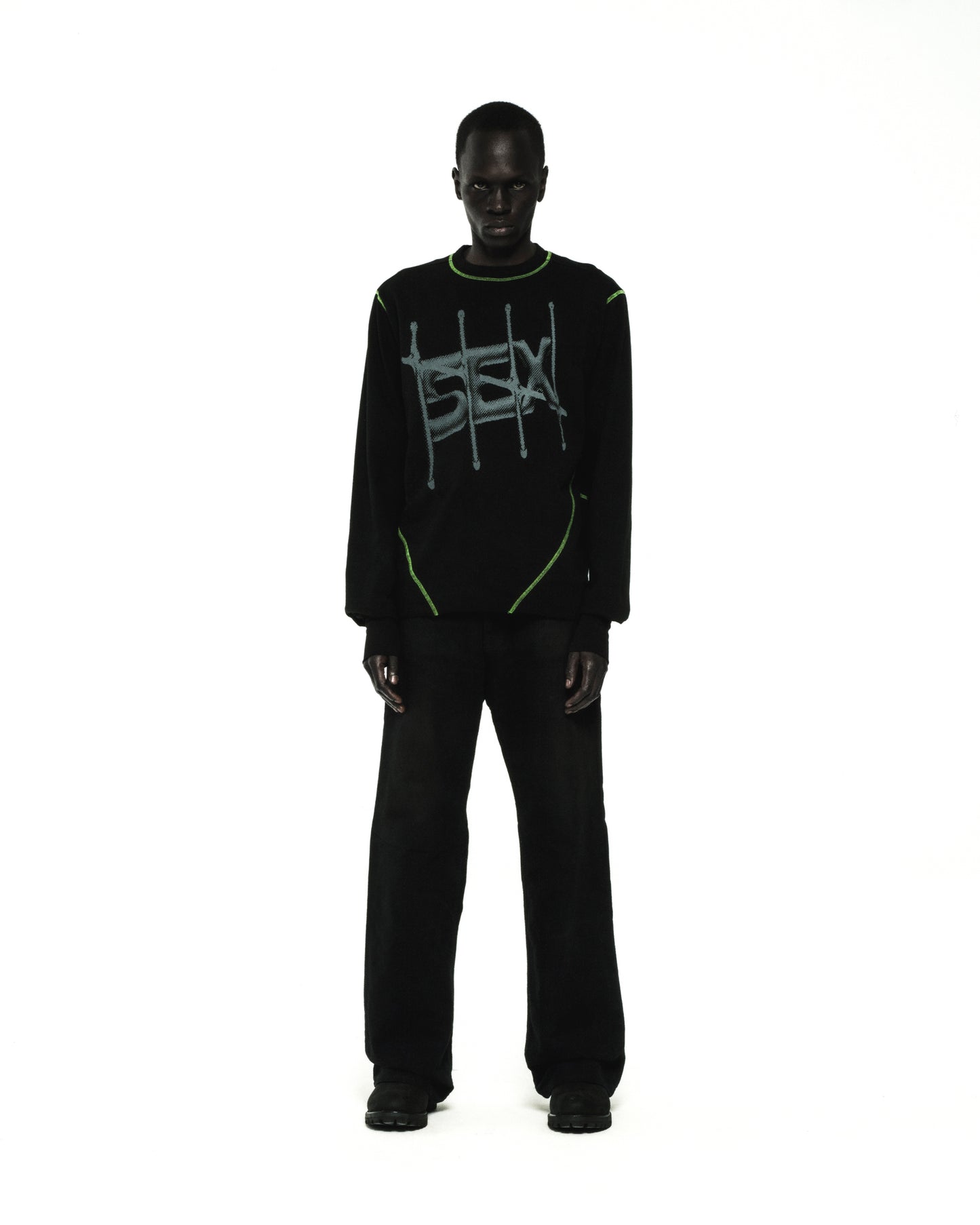 Black cotton SHADOWBANNED LONGSLEEVE with green contrast stitching and graphic print.