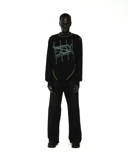 Black cotton SHADOWBANNED LONGSLEEVE with green contrast stitching and graphic print.