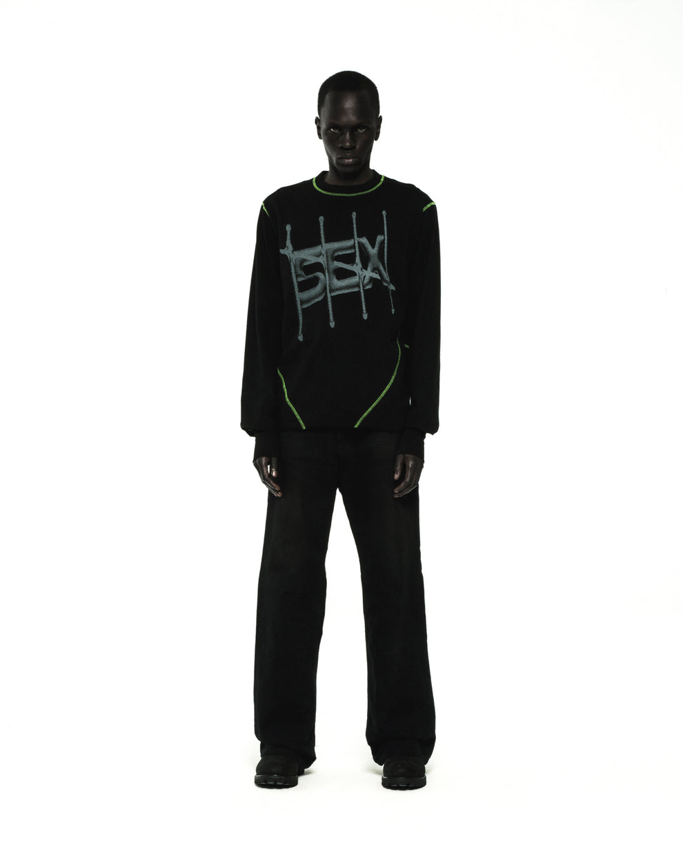 Black cotton SHADOWBANNED LONGSLEEVE with green contrast stitching and graphic print.