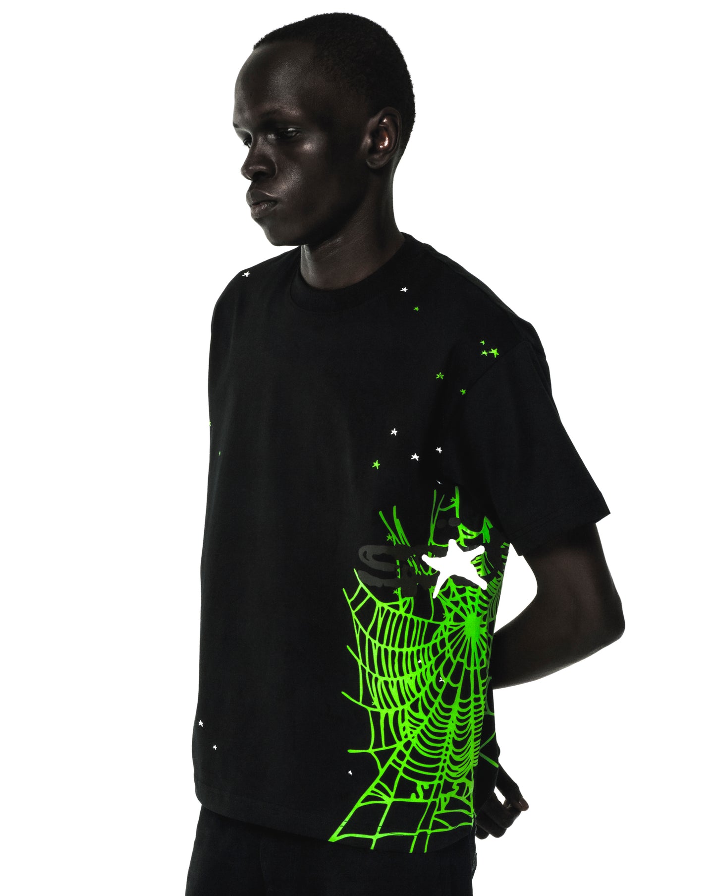 Black 100% cotton tee with a vibrant green heavy web graphic, white stars, and a standard fit.