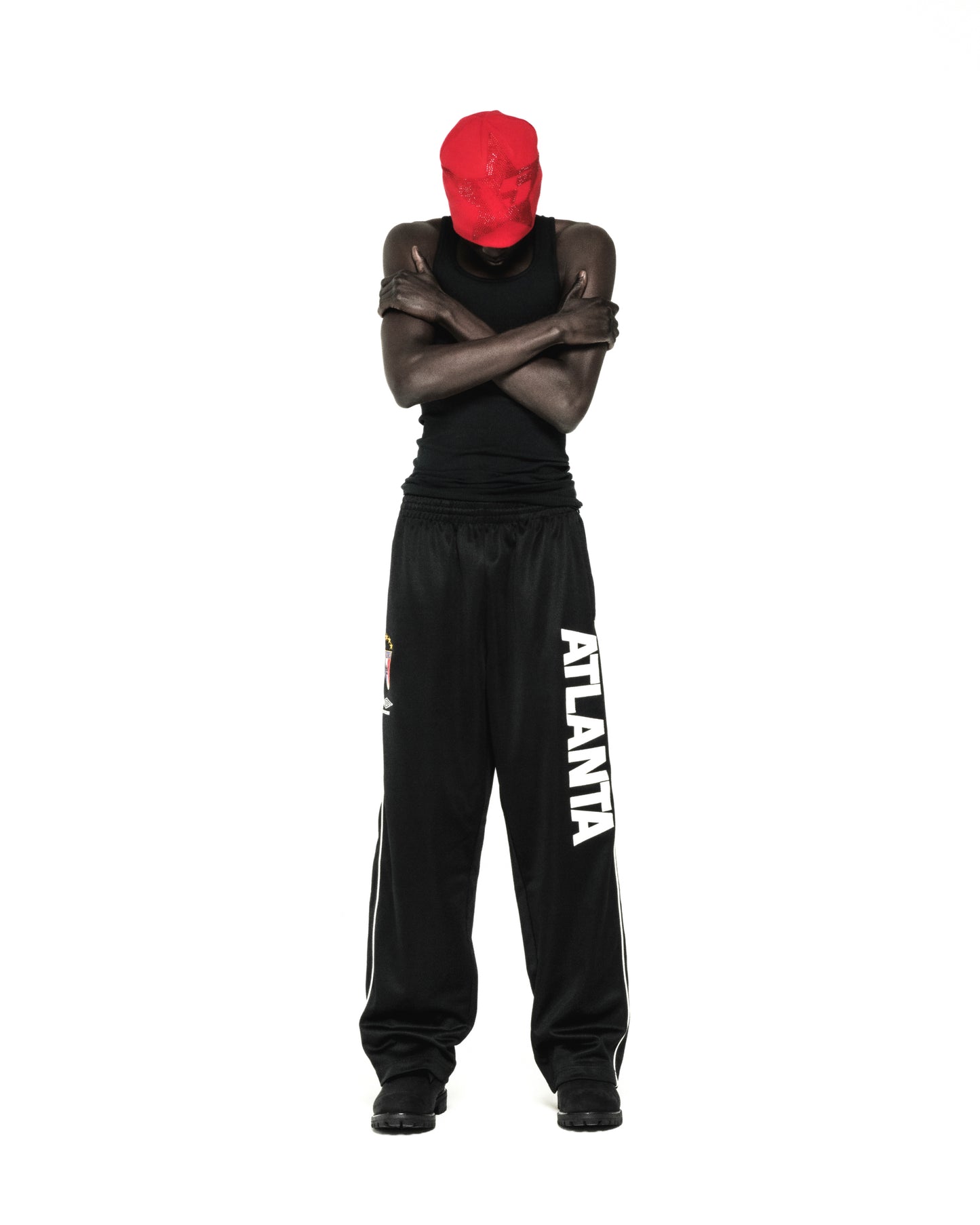 Black ATLANTA TRACK PANT with bold vertical graphic, SP5DER crest, and white contrast piping.