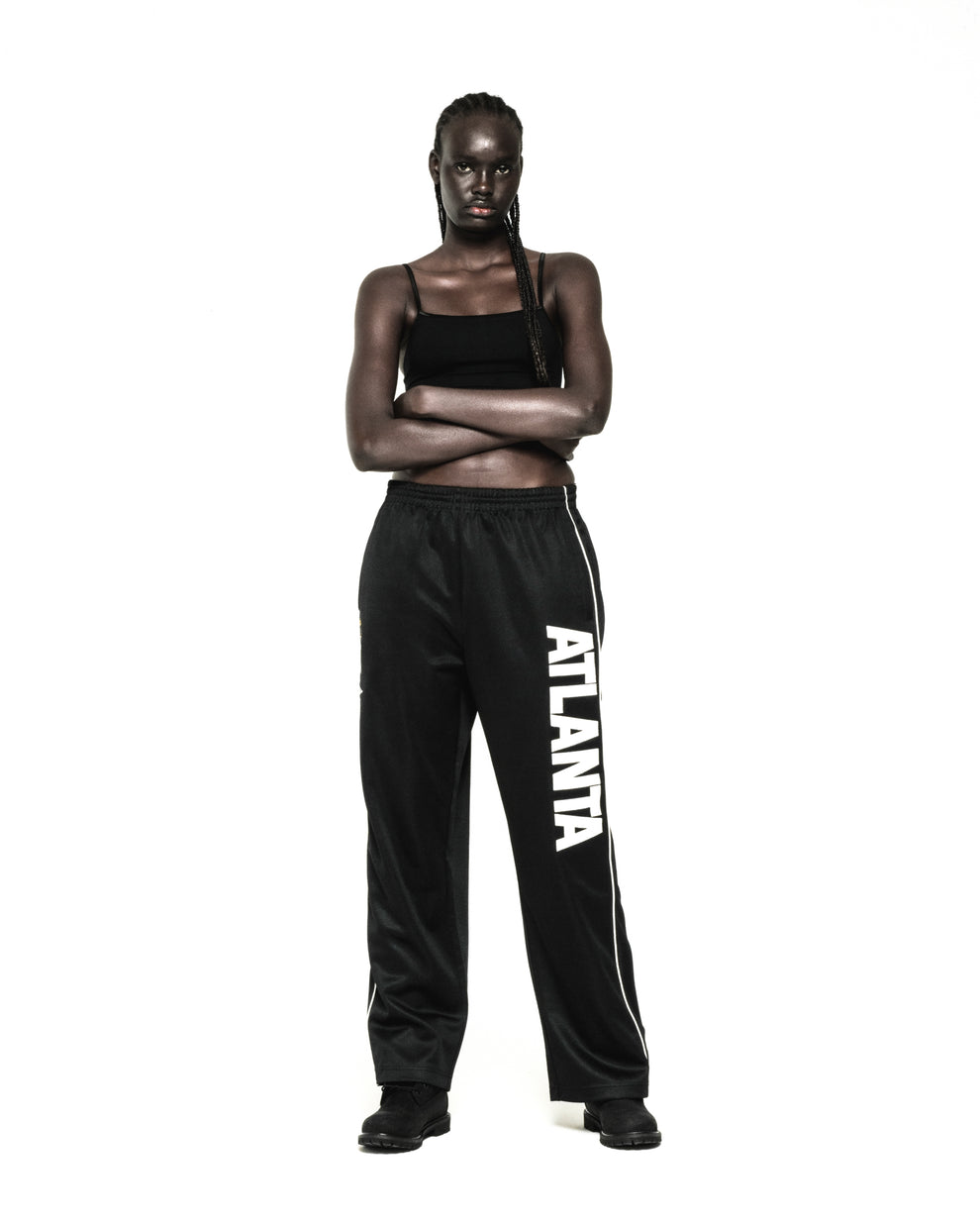 Black ATLANTA TRACK PANT with bold vertical graphic, SP5DER crest, and white contrast piping.