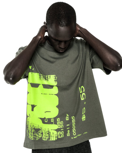 Dark-skinned model wearing a standard fit, olive green 100% cotton tee with a large neon green graphic print.