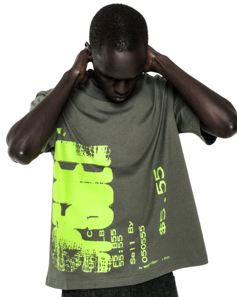 Dark-skinned model wearing a standard fit, olive green 100% cotton tee with a large neon green graphic print.