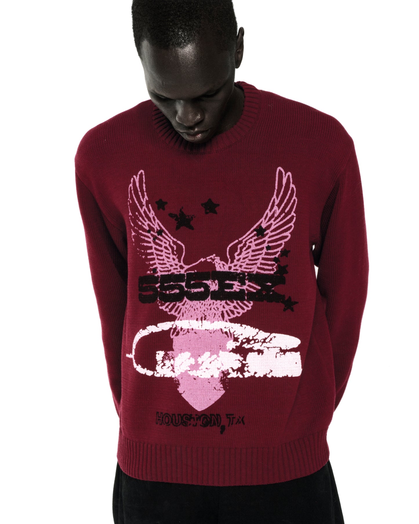 Red knit sweater with pink eagle graphic, "555EX" text, stars, and "HOUSTON, TX" on front.
