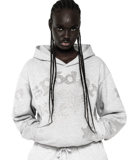 Light grey RHINESTONE BELUGA HOODIE with 'SP5DER' and star design, kangaroo pocket, rib knit hem and cuffs.