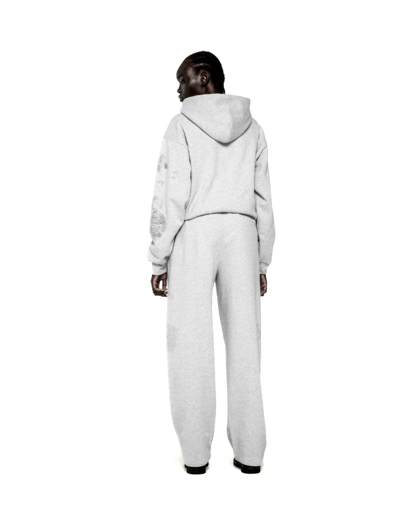 Light grey RHINESTONE BELUGA HOODIE and sweatpants set with 'SP5DER' and star design.
