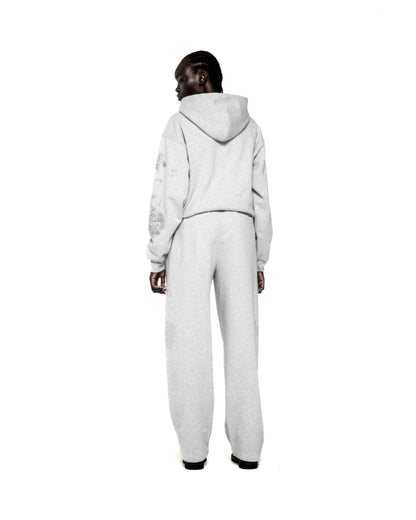 Light grey RHINESTONE BELUGA HOODIE and sweatpants set with 'SP5DER' and star design.