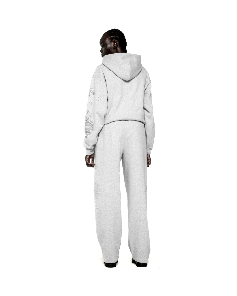 Light grey RHINESTONE BELUGA HOODIE and sweatpants set with 'SP5DER' and star design.
