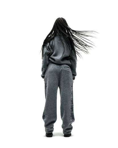 Gray sherpa fleece zip-up jacket and matching pants with web print and rhinestone embellishments.
