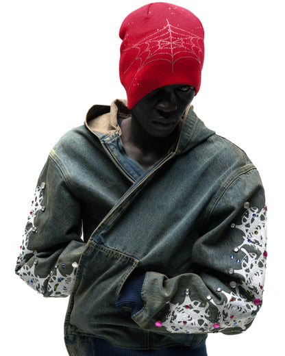 Red acrylic rhinestone silk skully with spiderweb design, worn by a model.