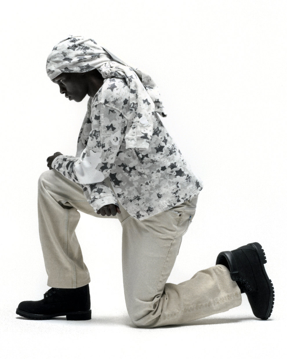 Beluga AOP thermal with star camo print, ribbed details, and matching headwrap, paired with beige pants and black boots.