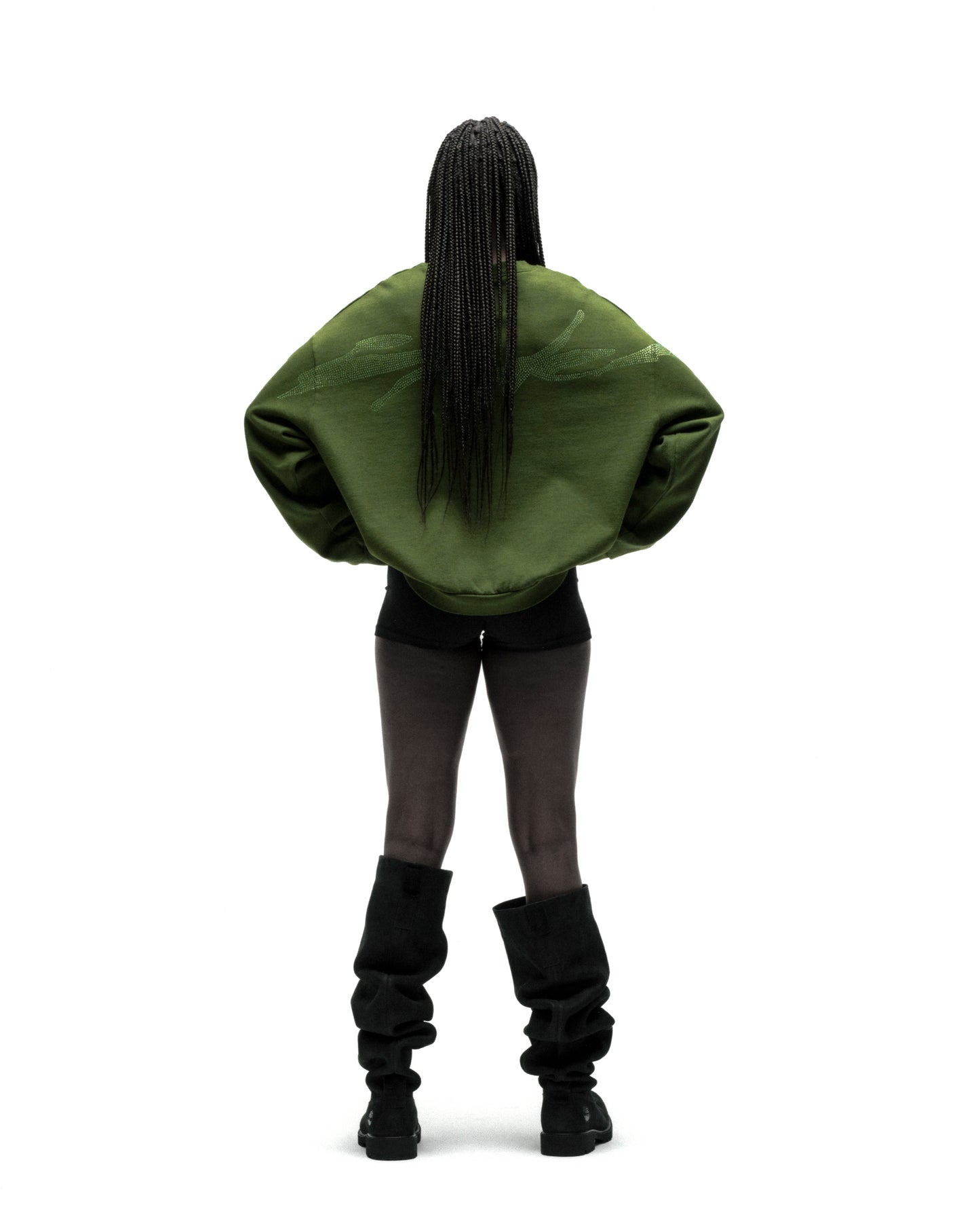 Back view of a person wearing an oversized olive green RHINESTONE TM CREWNECK with embellished graphic.
