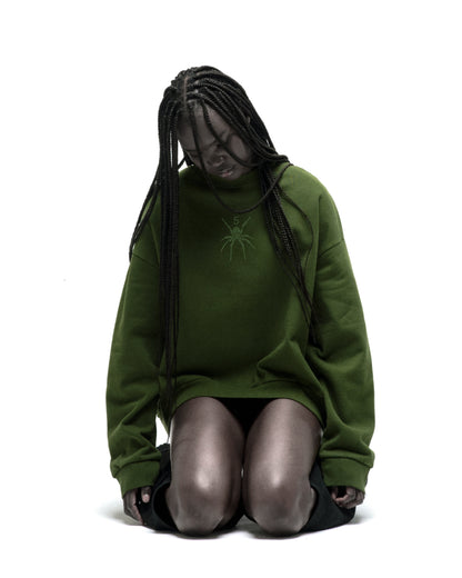 Green RHINESTONE TM CREWNECK with rhinestone spider graphic, 100% cotton brushed fleece.