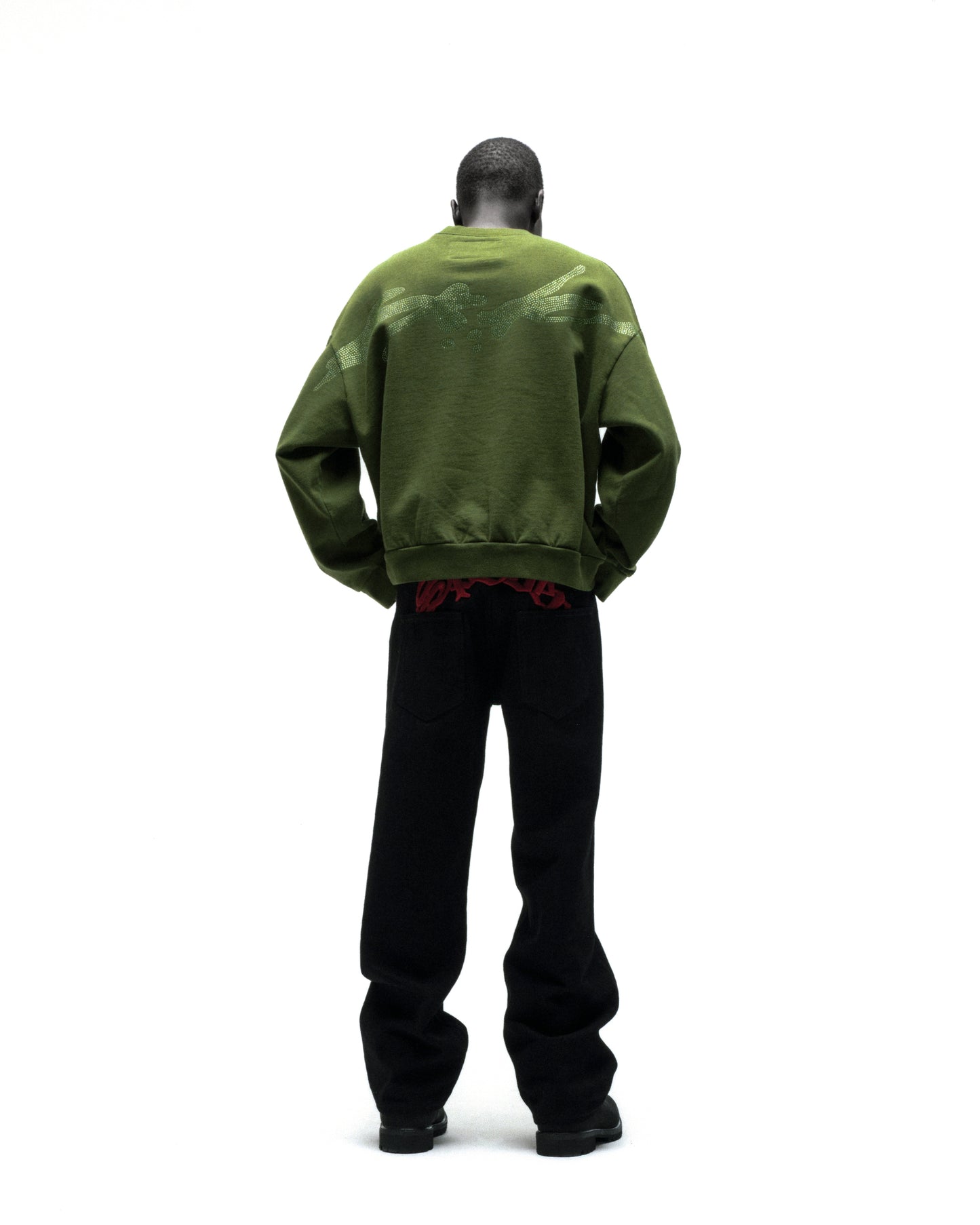 Green RHINESTONE TM CREWNECK, 100% cotton brushed fleece, with rhinestone graphic on back.