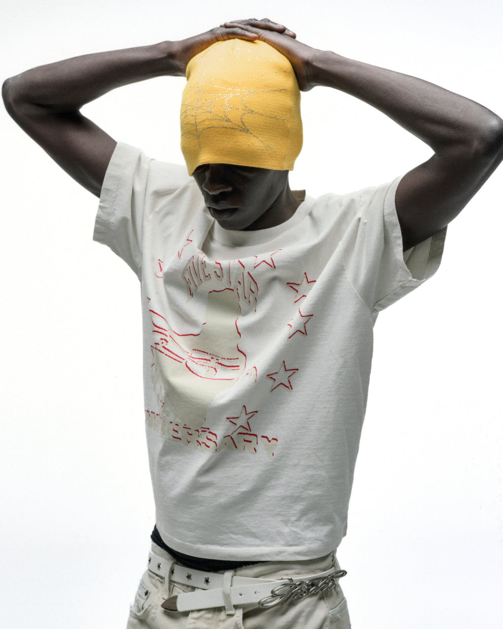 Yellow rhinestone silk skully on a model, featuring an embellished design.