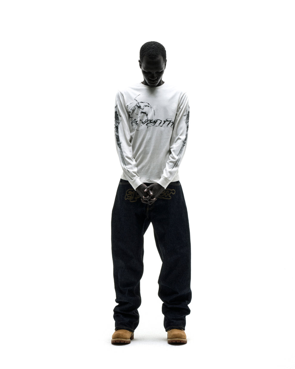 WAIT LONGSLEEVE: White 100% cotton long sleeve tee with graphic prints on sleeves, ribbed collar and cuffs.