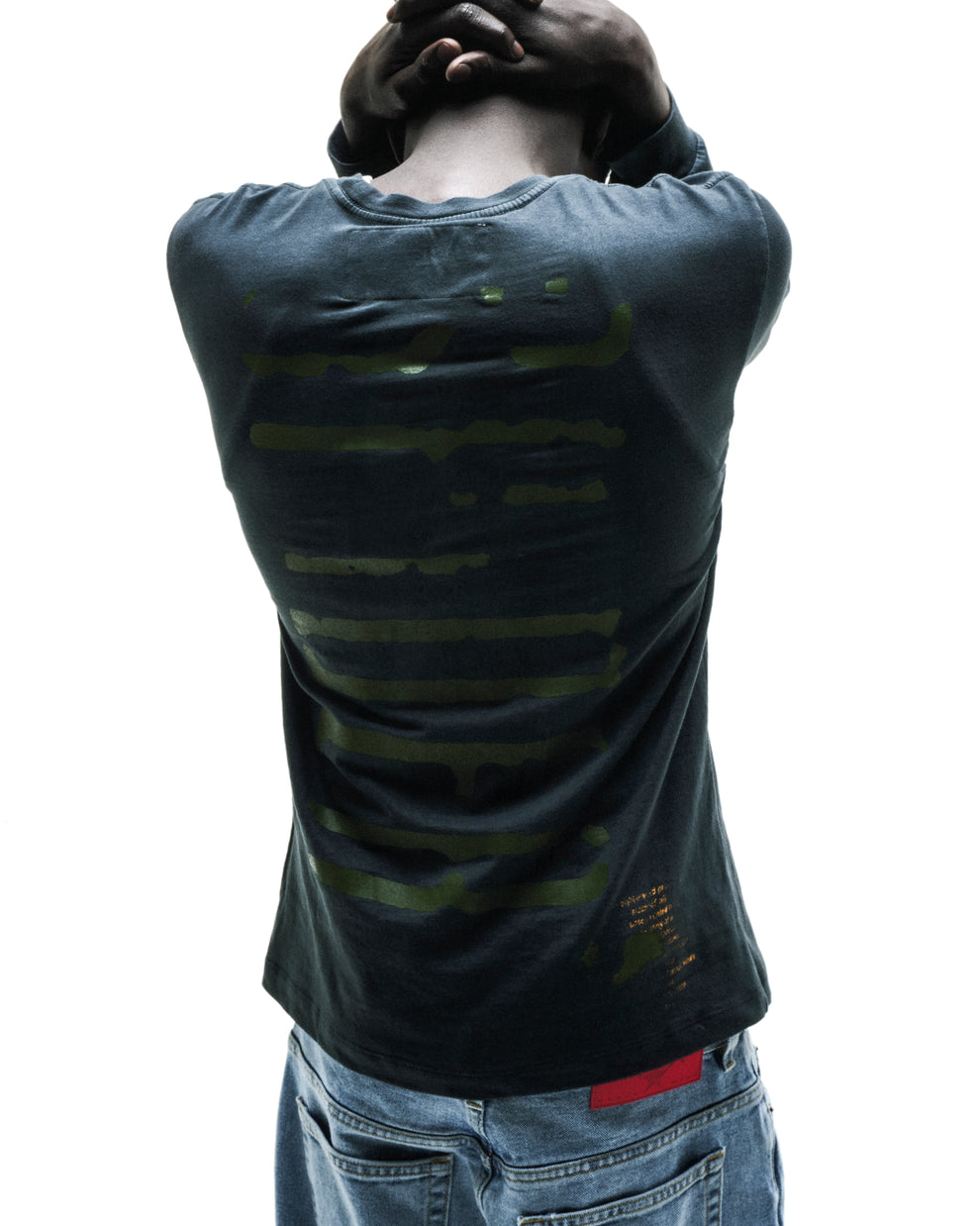 WAIT LONGSLEEVE: Dark grey 100% cotton long sleeve tee with green graphic print on back.